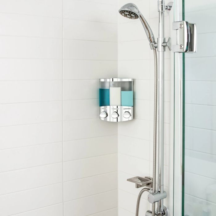 A modern shower featuring a streamlined wall-mounted soap dispenser with three separate compartments, ensuring a clutter-free and stylish bathroom setup.