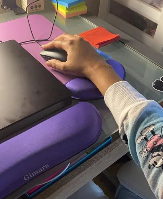 Another reviewer's photo showing them using the purple keyboard and mouse wrist rests.