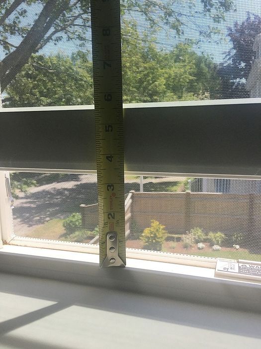 A measuring tape shows how much the window can still open after the lock is installed. The lock can be positioned as high as desired, leaving ample room for ventilation.