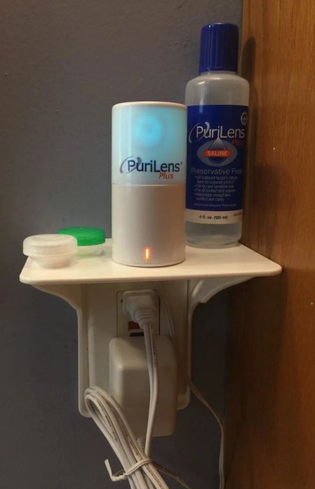 another reviewer photo showing contact items and various other things stored on the outlet shelf