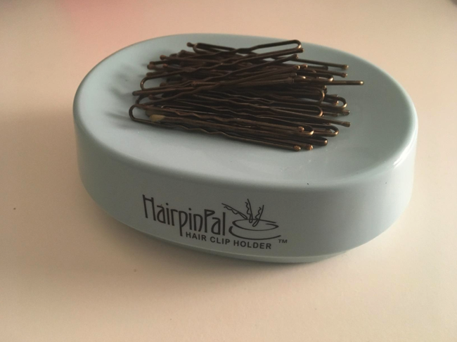 A reviewer’s magnetic tray holding a bunch of bobby pins