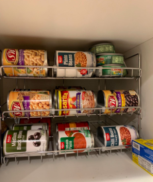 The can holder neatly arranged in the pantry.