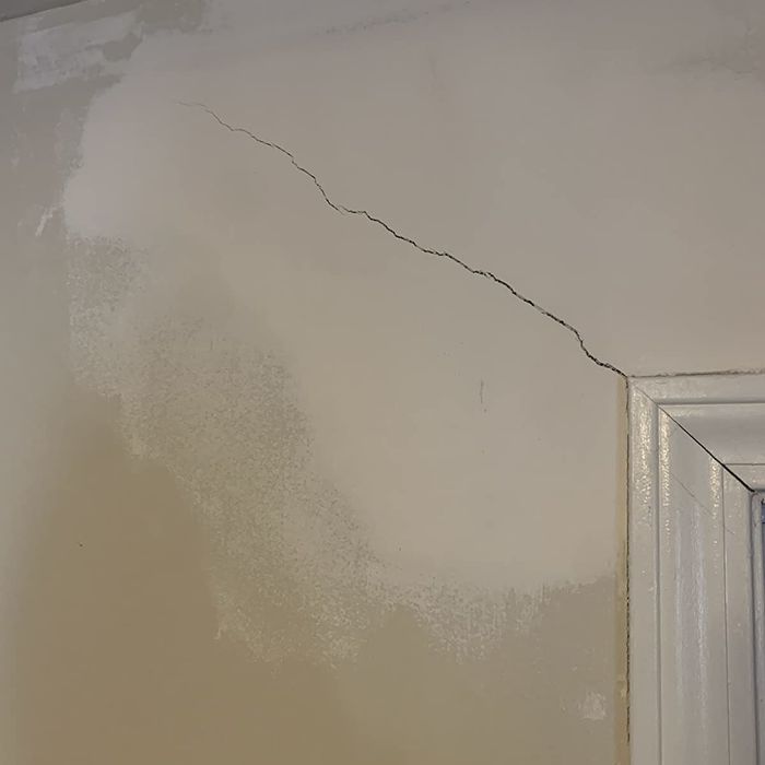 Before: A two-foot crack visible on a reviewer’s wall in need of repair