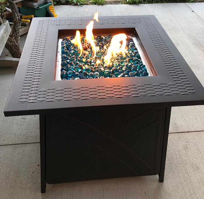 Reviewer image featuring a black fire pit with vibrant flames creating a cozy ambiance.