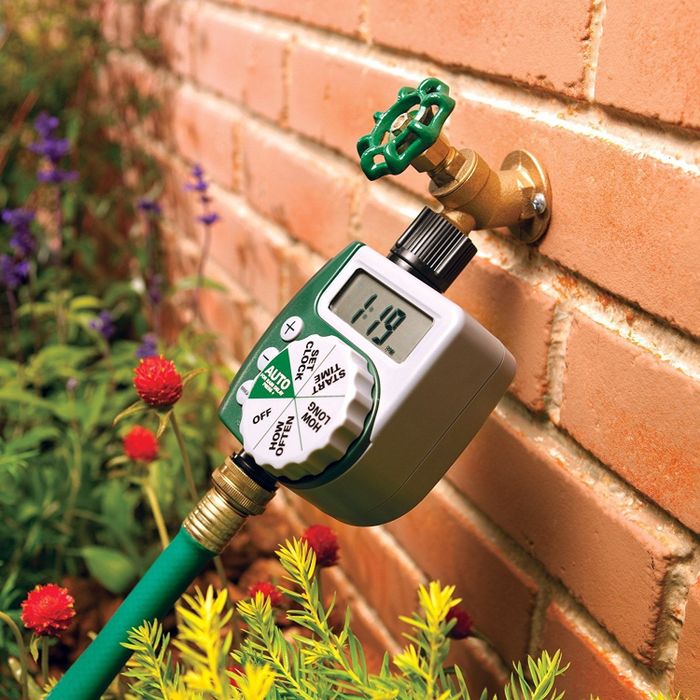 The timer attached to a hose nozzle