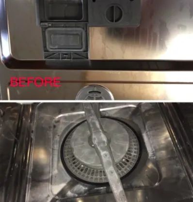 A reviewer's photo showing the inside of a dishwasher covered in residue.