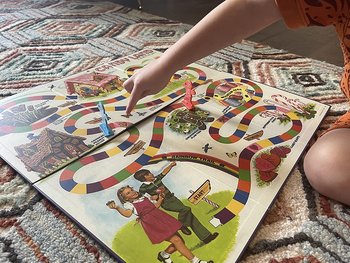 A vintage Candy Land board game spread out on the floor