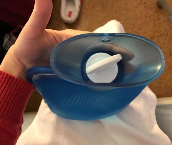 An overhead shot of the bottle showcasing the white stopper lid