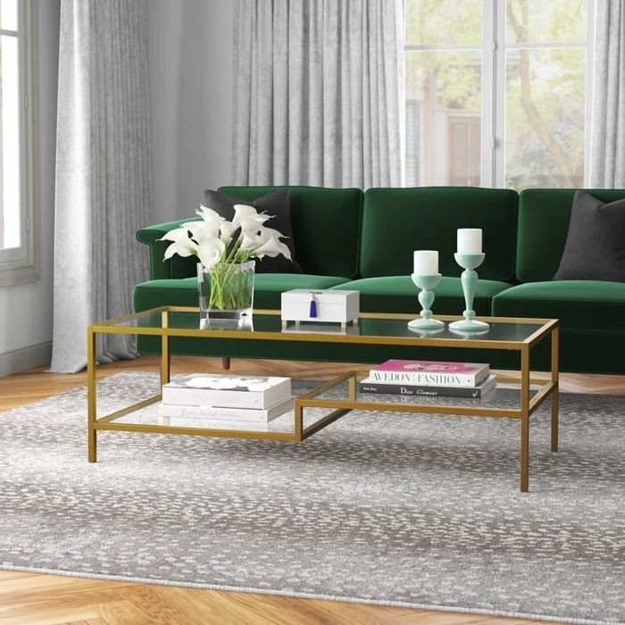 The same elegant glass table, now with a luxurious gold frame for a more sophisticated and stylish aesthetic.