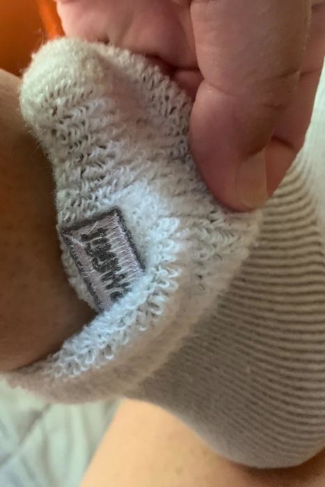 A reviewer’s photo showcasing the wool lining of the socks.