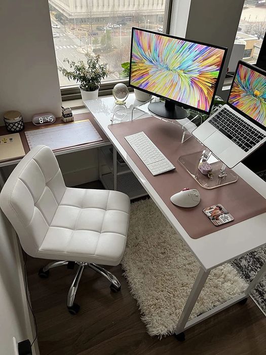 A work-from-home setup featuring the monitor positioned on the desk.