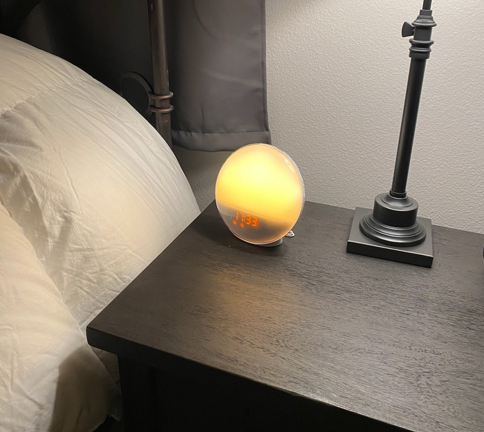 A circular alarm clock displaying the time