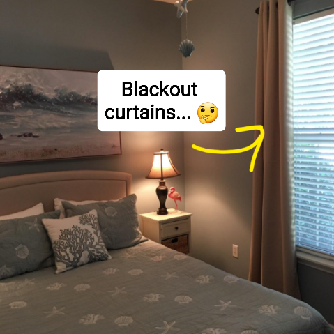 A reviewer's bedroom showing beige blackout curtains pulled open to reveal daylight outside