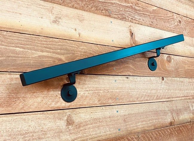 A simple black rectangular handrail