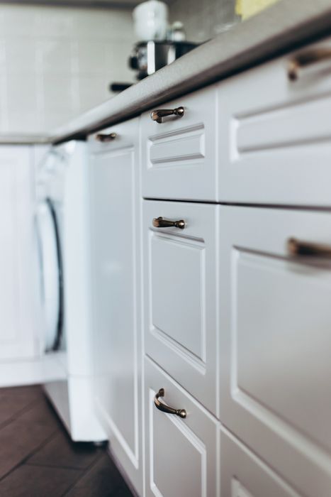 Brass pulls on kitchen cabinets