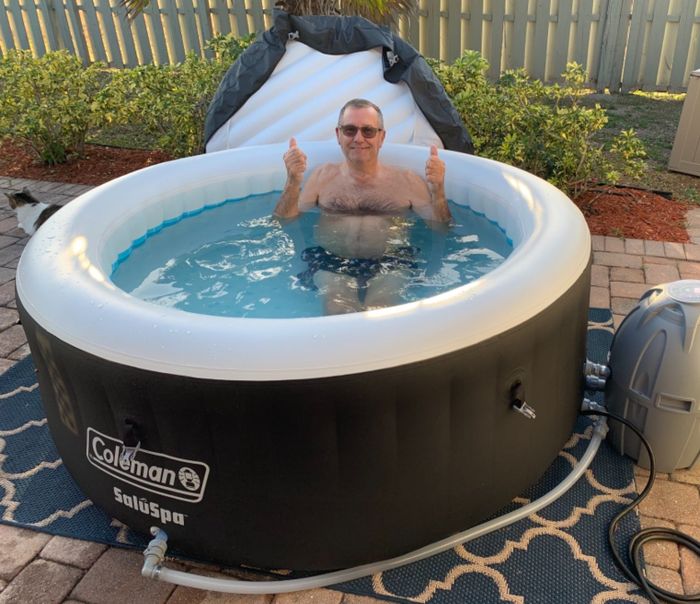 A reviewer enjoying the hot tub