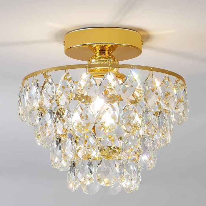 Sophisticated chandelier with cascading crystal accents, the perfect touch of luxury for any home decor.