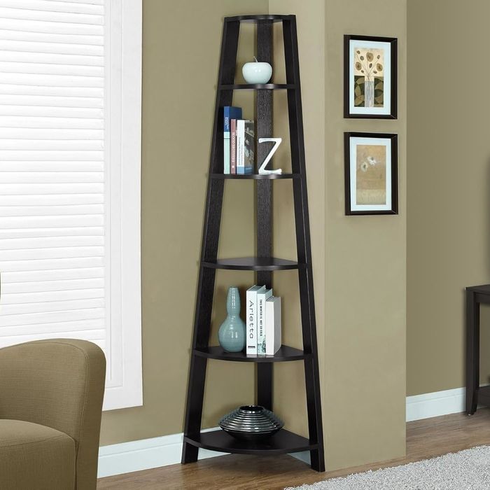 A chic, modern black corner shelf unit adorned with decorative pieces like a sleek vase and elegantly framed photos.