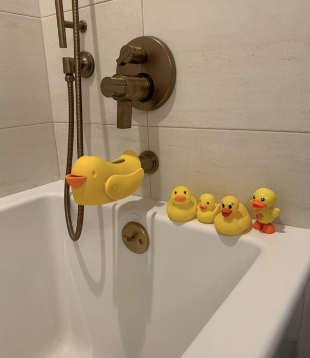 A bathtub filled with cheerful rubber duckies