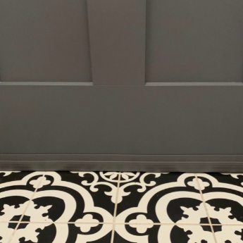 A different reviewer’s door, painted in graphite gray, with a matching draft stopper at the bottom