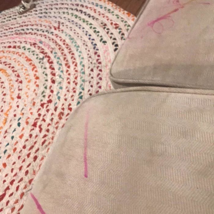 A reviewer’s couch marked up with pink Sharpie, a reminder of an unfortunate mishap.