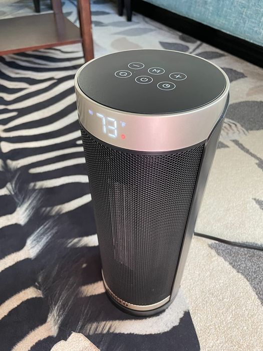 A photo from the reviewer showing the space heater set to 73 degrees