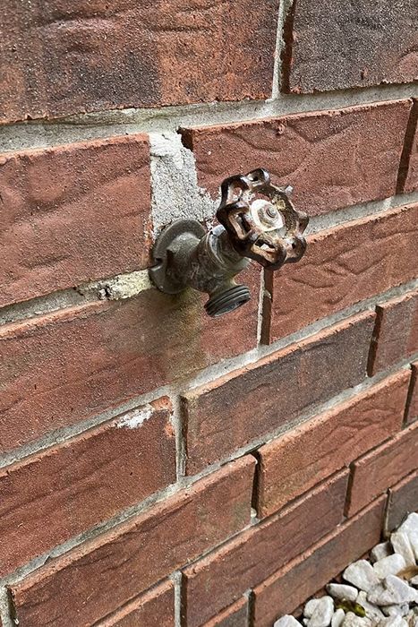 The faucet spout covered with a protective cover