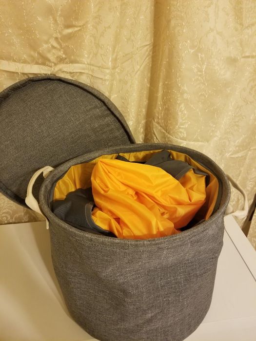 The mat neatly rolled up into the storage bag.