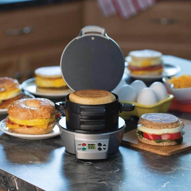 A sandwich maker with three compartments, seamlessly cooking and layering bread, eggs, and toppings for a flawless breakfast.