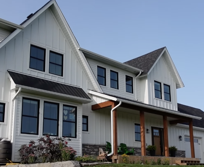 The facade of a white farmhouse-style home