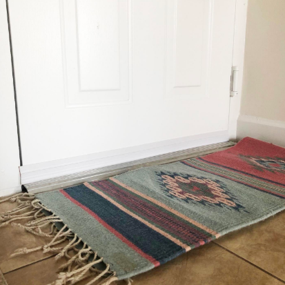 A reviewer’s photo of a door with the draft stopper covering the bottom edge
