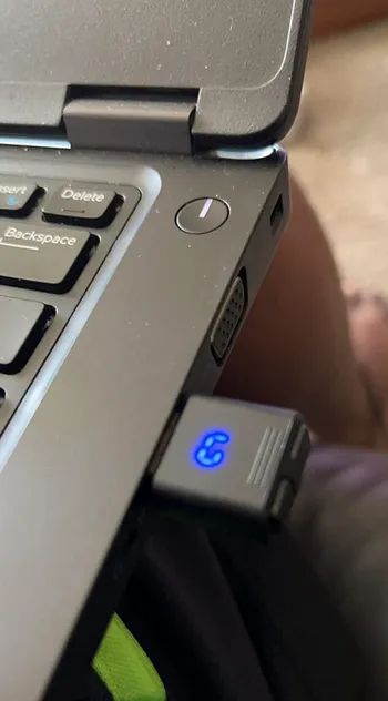 A USB stick plugged into a laptop, enabling mouse movement.