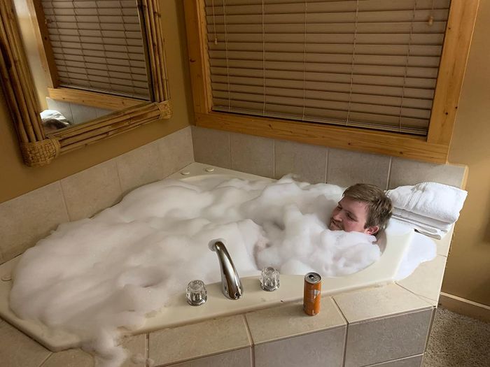 A reviewer enjoying their jet bathtub