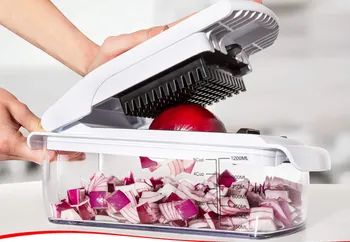 The model pressing down on the top to slice an onion.