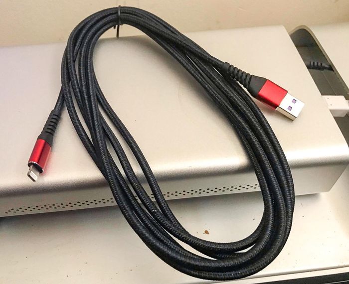 A 10-foot red and black charger, ready to power up your device.