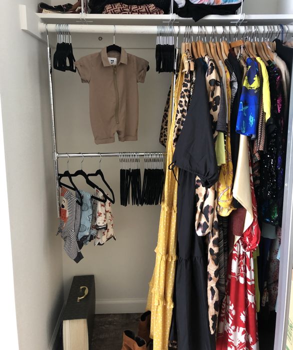 A closet featuring the double hanging rod in use