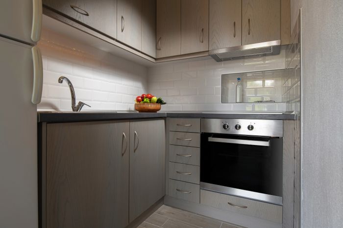 Gray kitchen with subway tile backsplash.