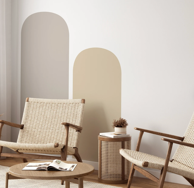 Two wall decals in different sizes and colors, artfully arranged on a wall.