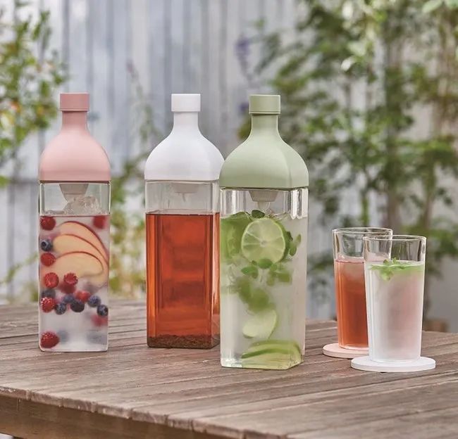The diffusers available in soft pink, white, and light green hues