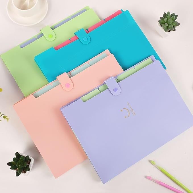 Four folded accordion file folders in shades of purple, pink, blue, and green