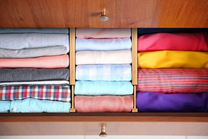 A photo showing the dividers placed inside a dresser drawer, perfectly organizing the contents.