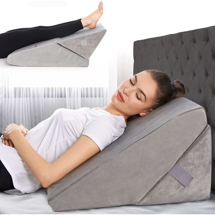 A woman lounging on a wedge pillow with an inset showing the use of the pillow for leg support. This article is related to both shopping and wellness, highlighting the comfort and versatility of wedge pillows.
