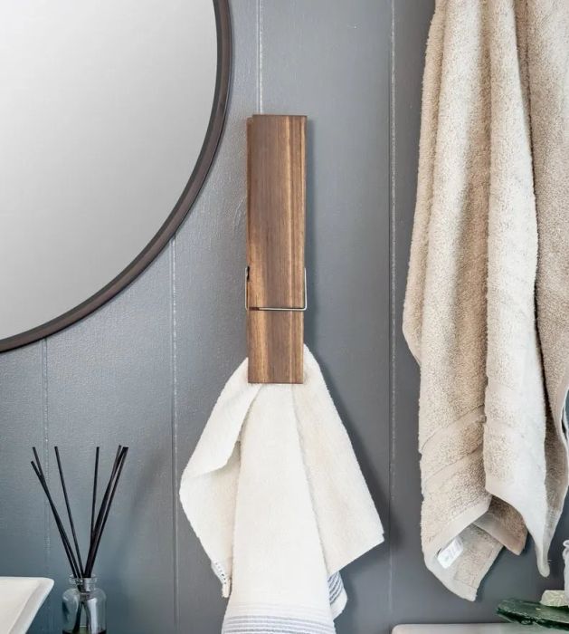 A jumbo clothespin securely holding a towel in place.