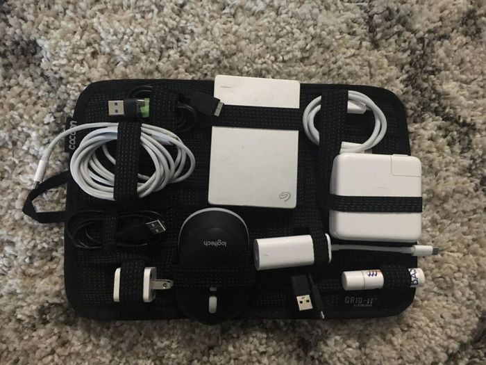 All the cords and wires neatly wrapped and tucked into the cloth organizer.