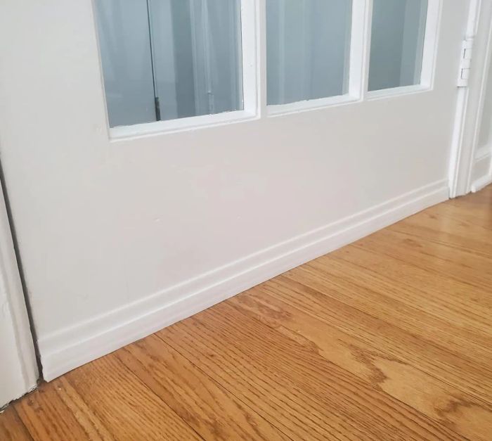 A door with the white stopper applied to seal any gaps.