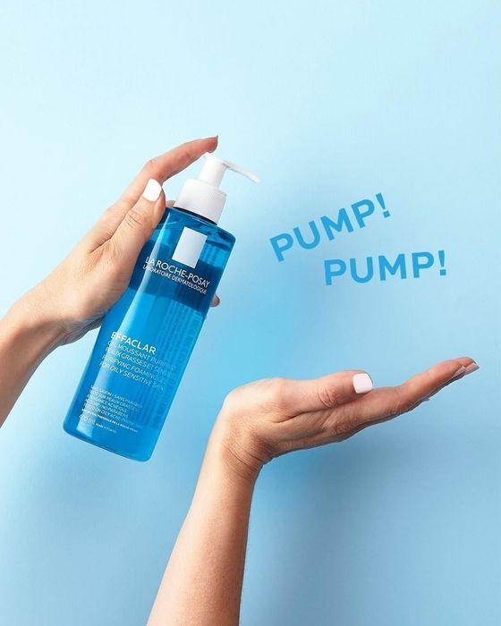Hand pumping the cleanser with the words 