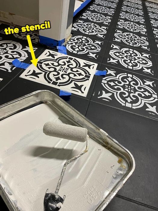 A reviewer using a stencil to add a creative design to their floor.