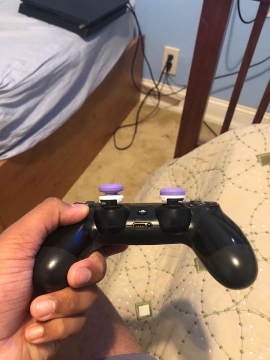 A close-up view of the thumbsticks, showcasing their varying heights.