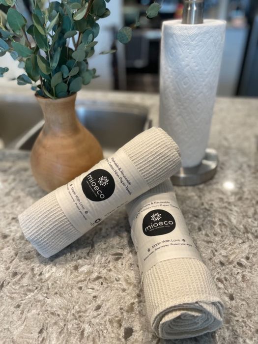 a reviewer presents the towels in their original packaging