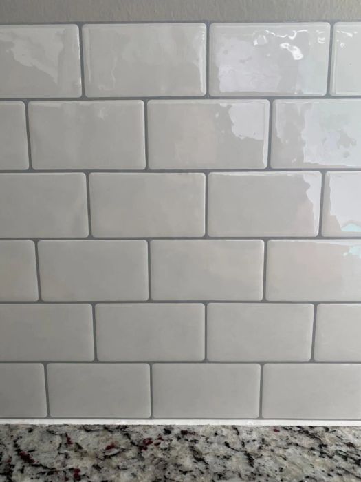 A close-up of white subway tile